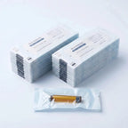Bulk 100-pack: two stacks of individually pouch-sealed amber 3 ml cartridges with one pouch showing an amber cartridge sealed inside