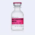 Pfizer Hospira bacteriostatic water 30 ml multi-dose vial standing upright, pink label and maroon flip-top cap, studio product photo