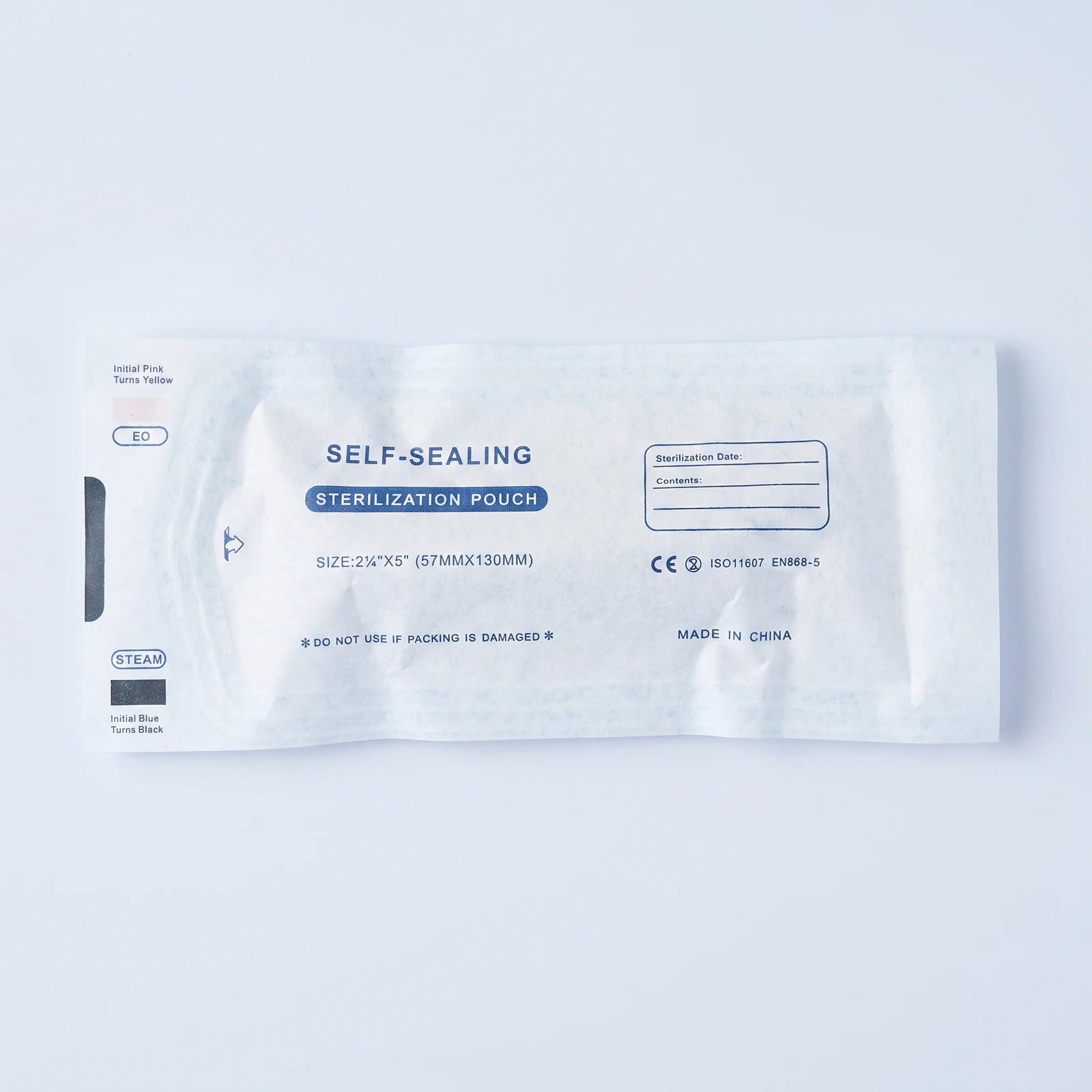 Paper back of the sealed cartridge pouch showing the self-sealing sterilization pouch print, EO and steam indicators, and ISO marking