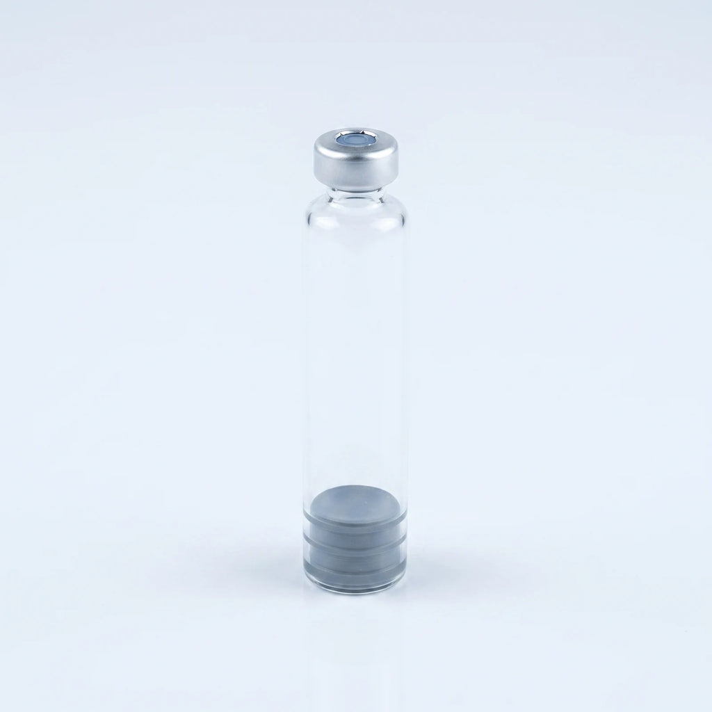 Eye-level view of the 3 ml glass pen cartridge standing upright with crimp cap on top and plunger at the base