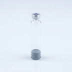 Eye-level view of the 3 ml glass pen cartridge standing upright with crimp cap on top and plunger at the base