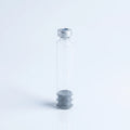 3 ml glass pen cartridge standing upright: silver crimp cap with center septum on top, ribbed rubber plunger seated inside the glass at the base