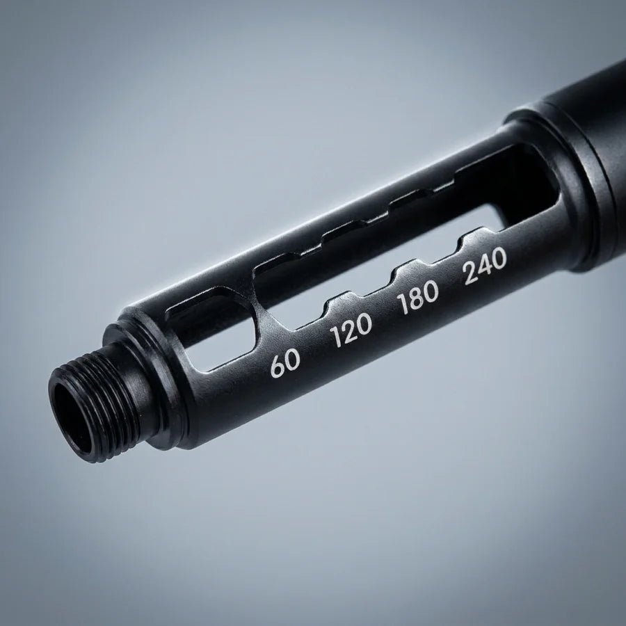 Macro close-up of the empty black cartridge holder, its unit scale and thread