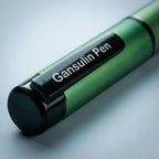 Macro close-up of the Gansulin pen cap, pocket clip and label plate