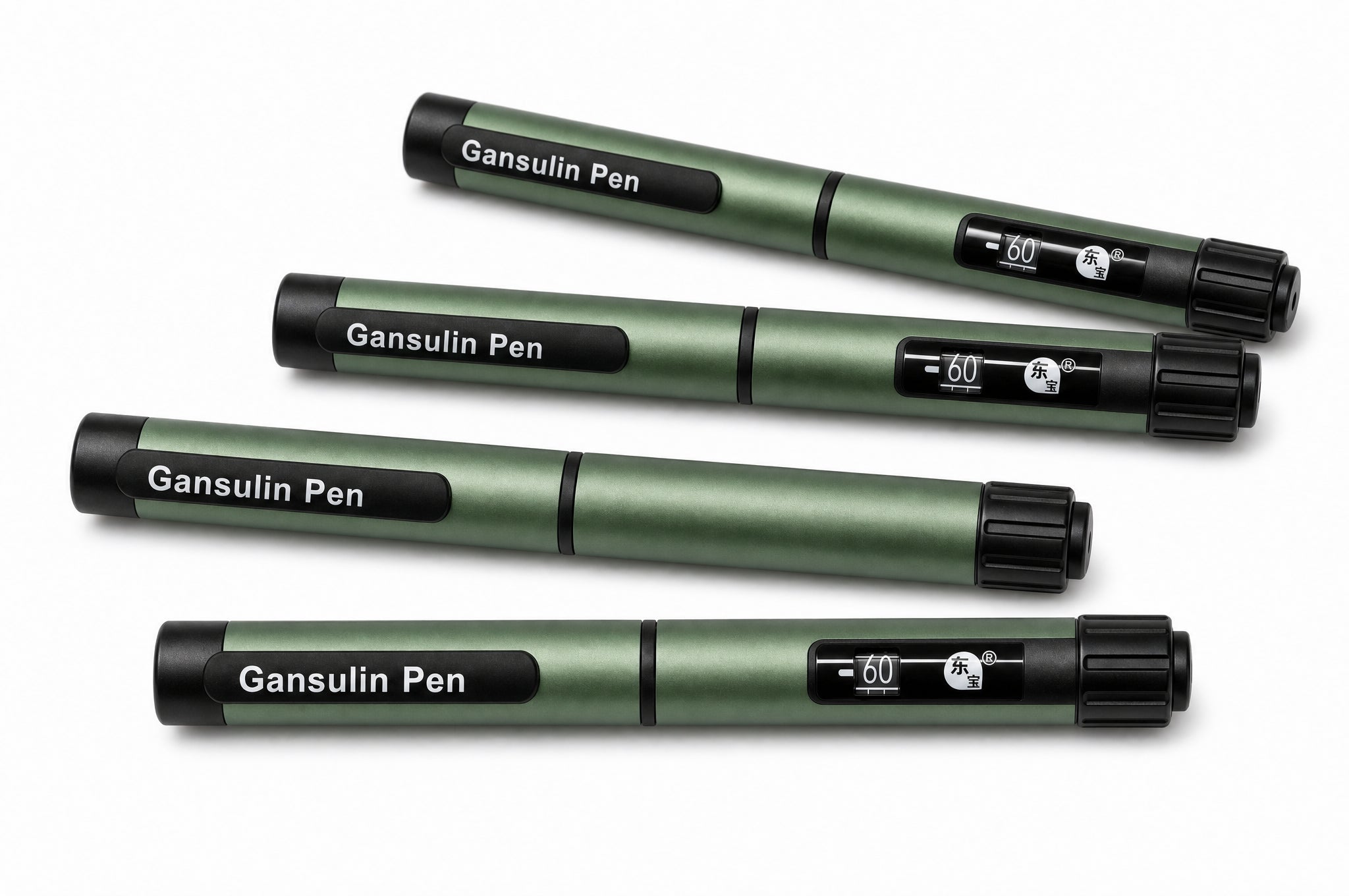 Four capped Gansulin pens laid out diagonally on a pale studio background