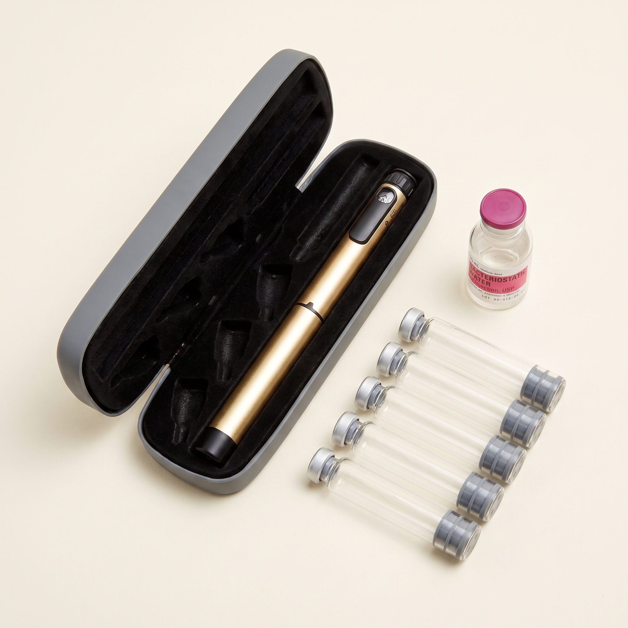 V1 pen starter kit: gold metal pen in grey hard case with 3 ml glass cartridges and bacteriostatic water