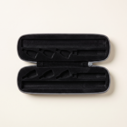 Portable pen carry case open, black foam interior with pen channel and slots