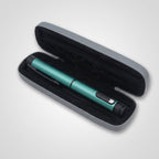 Teal V1 Peptide Pen, reusable manual click-dial pen, resting in its open grey hard case with black moulded foam