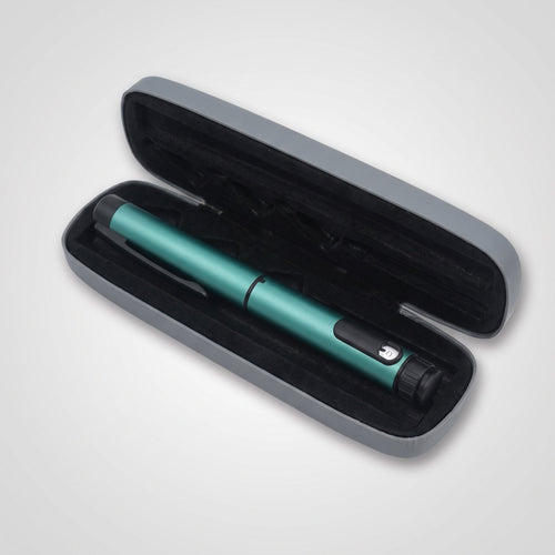 Teal V1 Peptide Pen, reusable manual click-dial pen, resting in its open grey hard case with black moulded foam