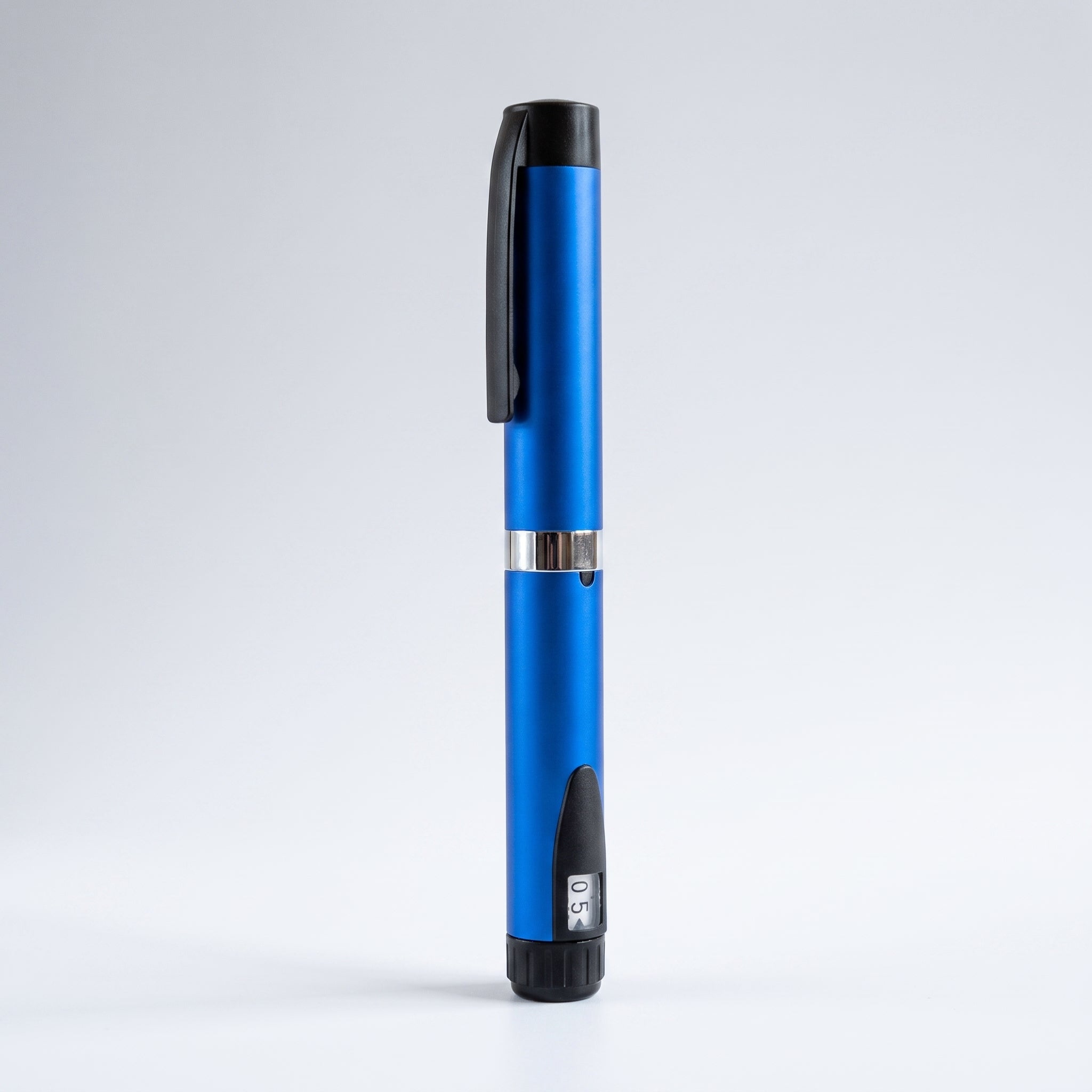 Blue V3 Peptide Pen, reusable aluminium click-dial pen, standing upright with the dose window reading 0.5