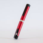 Red V3 Peptide Pen, reusable aluminium click-dial pen, angled diagonally on a pale studio background