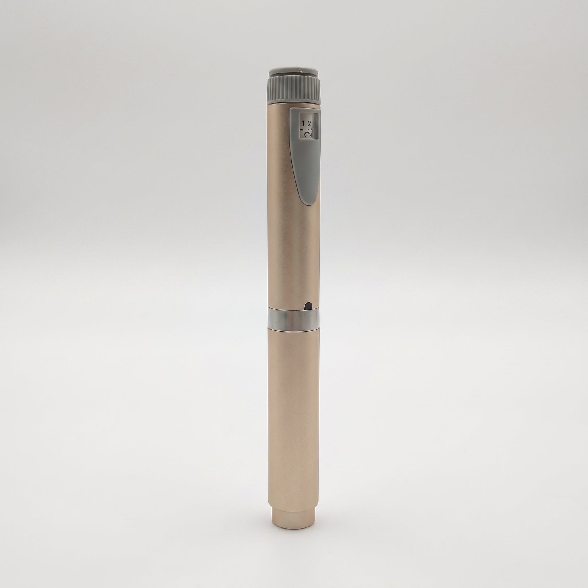 Champagne V2 Peptide Pen, reusable 60-unit pen with needle shield, standing upright with its chrome mid-band visible