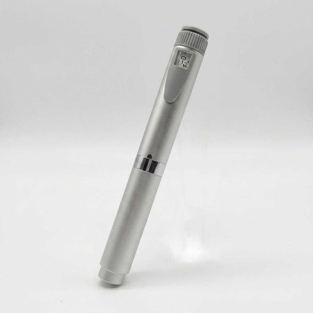 Silver V2 Peptide Pen, reusable 60-unit pen with needle shield, angled diagonally with the dose counter visible