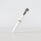 White V2 Peptide Pen, reusable 60-unit pen with needle shield, angled diagonally with a grey dial cap
