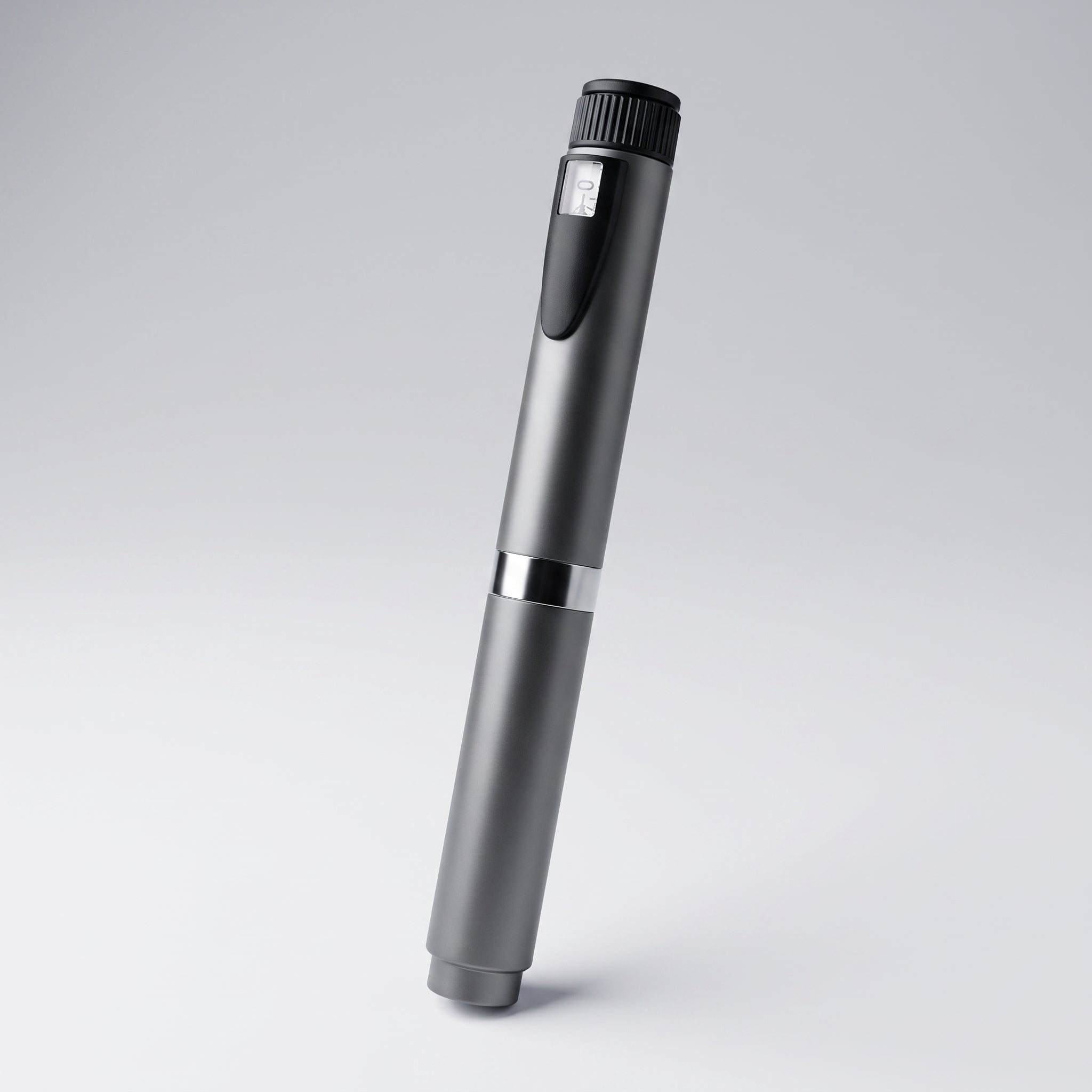 Gunmetal V2 Peptide Pen, reusable 60-unit pen with needle shield, angled diagonally on a pale studio background