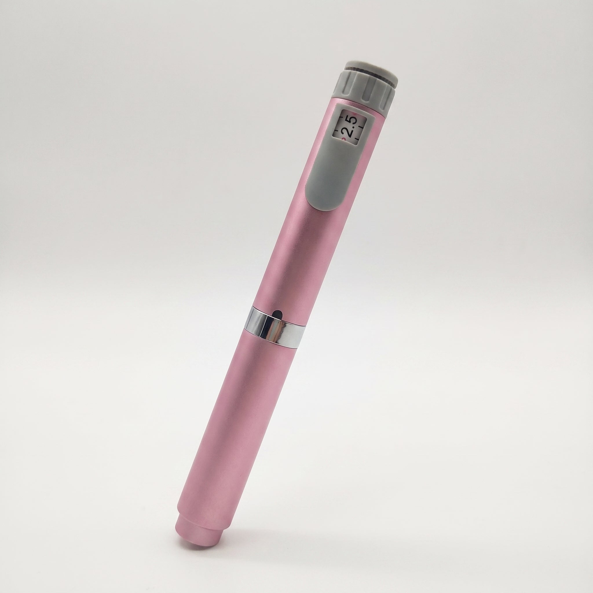 Pink V2 Peptide Pen, reusable 60-unit pen with needle shield, dose counter showing 2.5, angled on a pale studio background