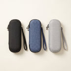 Three EVA travel cases side by side in black, denim blue and light grey, each with a wrist strap
