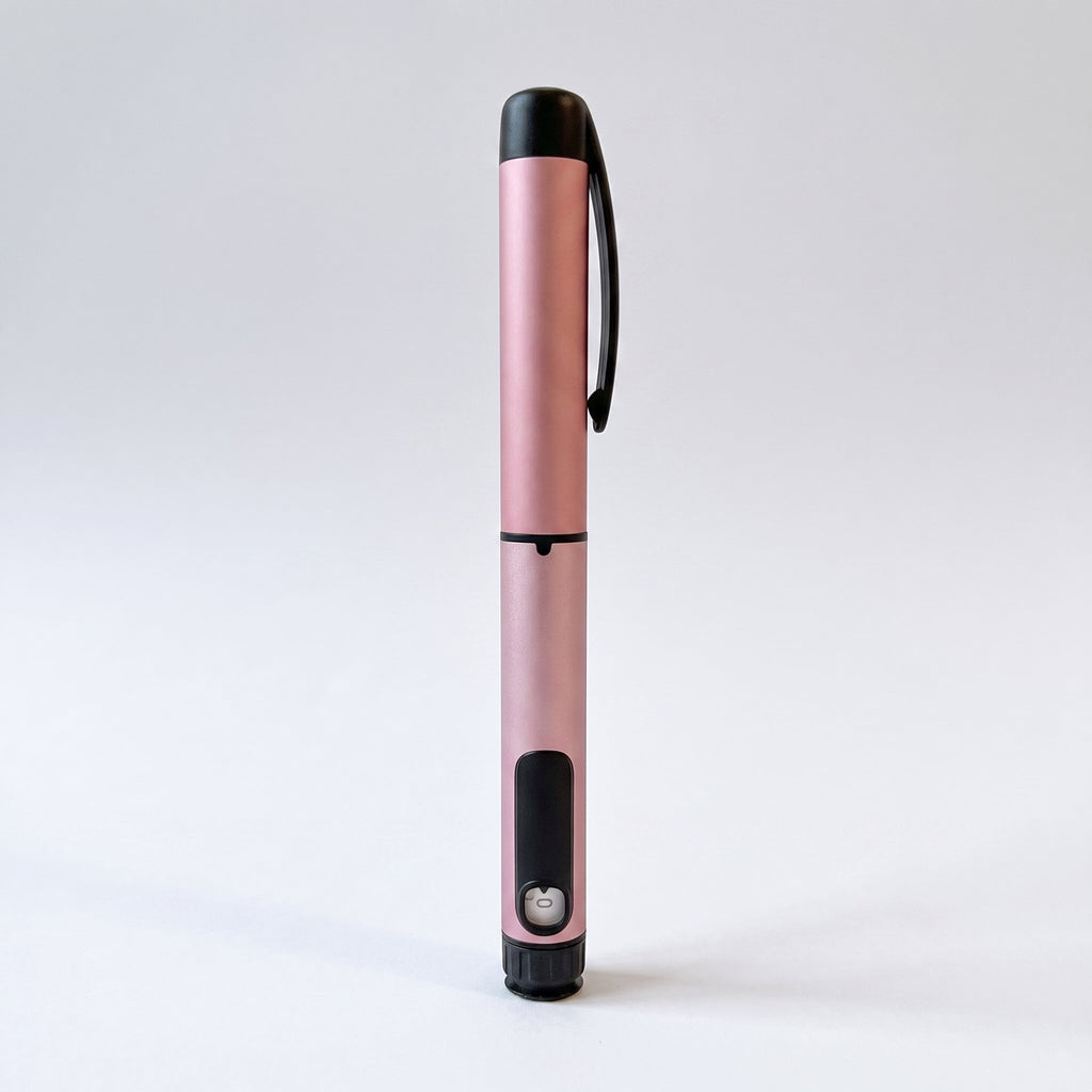 Pale pink V1 Peptide Pen, reusable manual click-dial pen, standing upright on a pale studio background