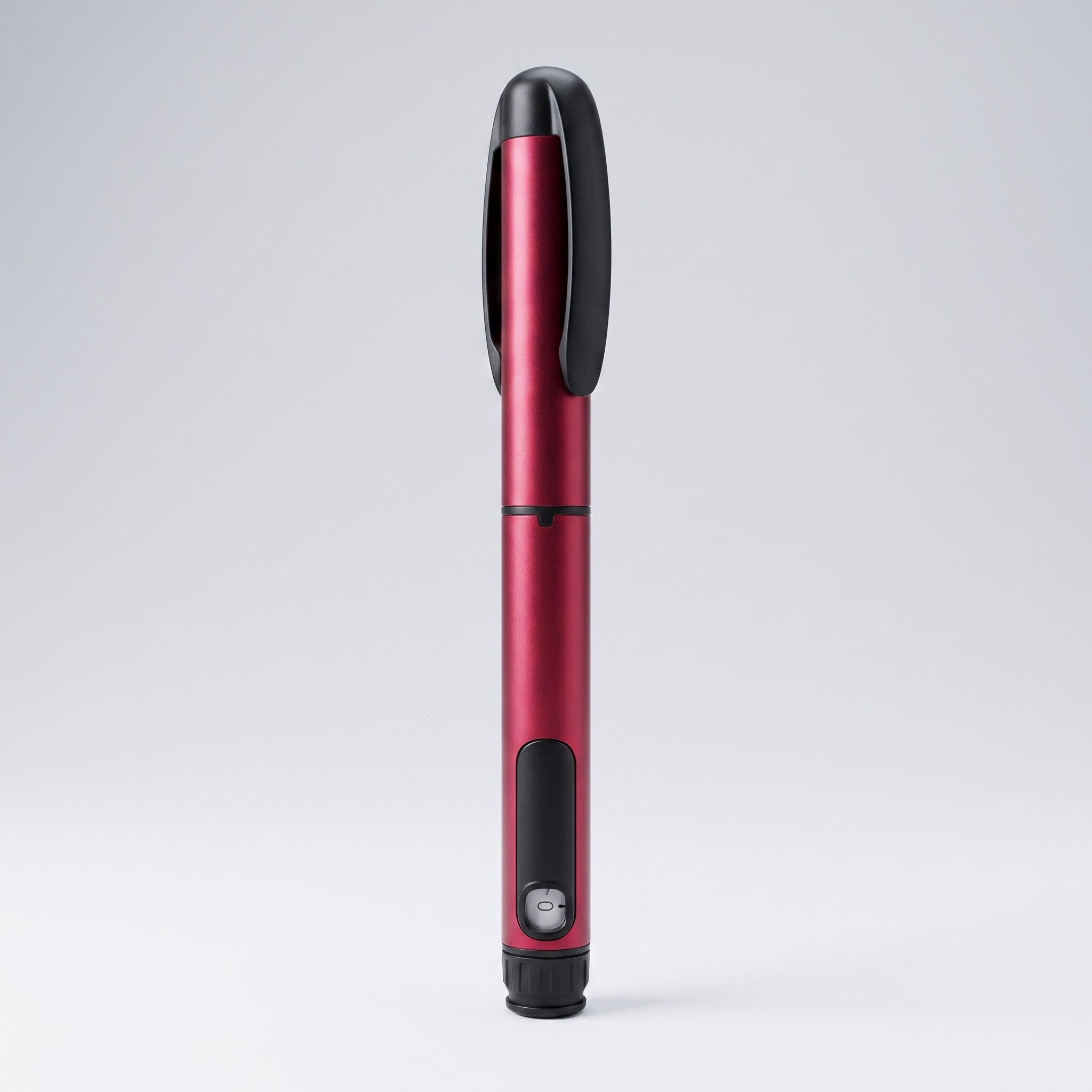 Crimson red V1 Peptide Pen, reusable manual click-dial pen, angled diagonally on a pale studio background
