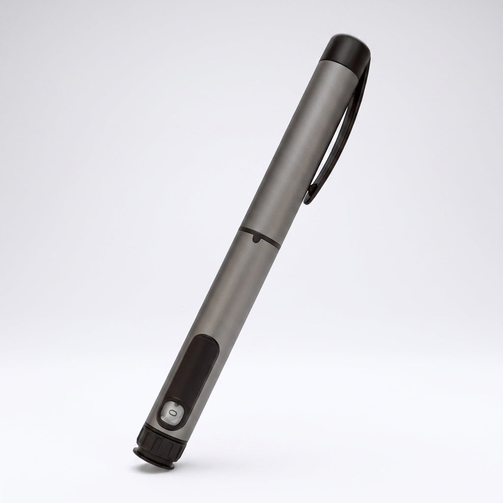 Gunmetal grey V1 Peptide Pen, reusable manual click-dial pen, angled diagonally on a pale studio background