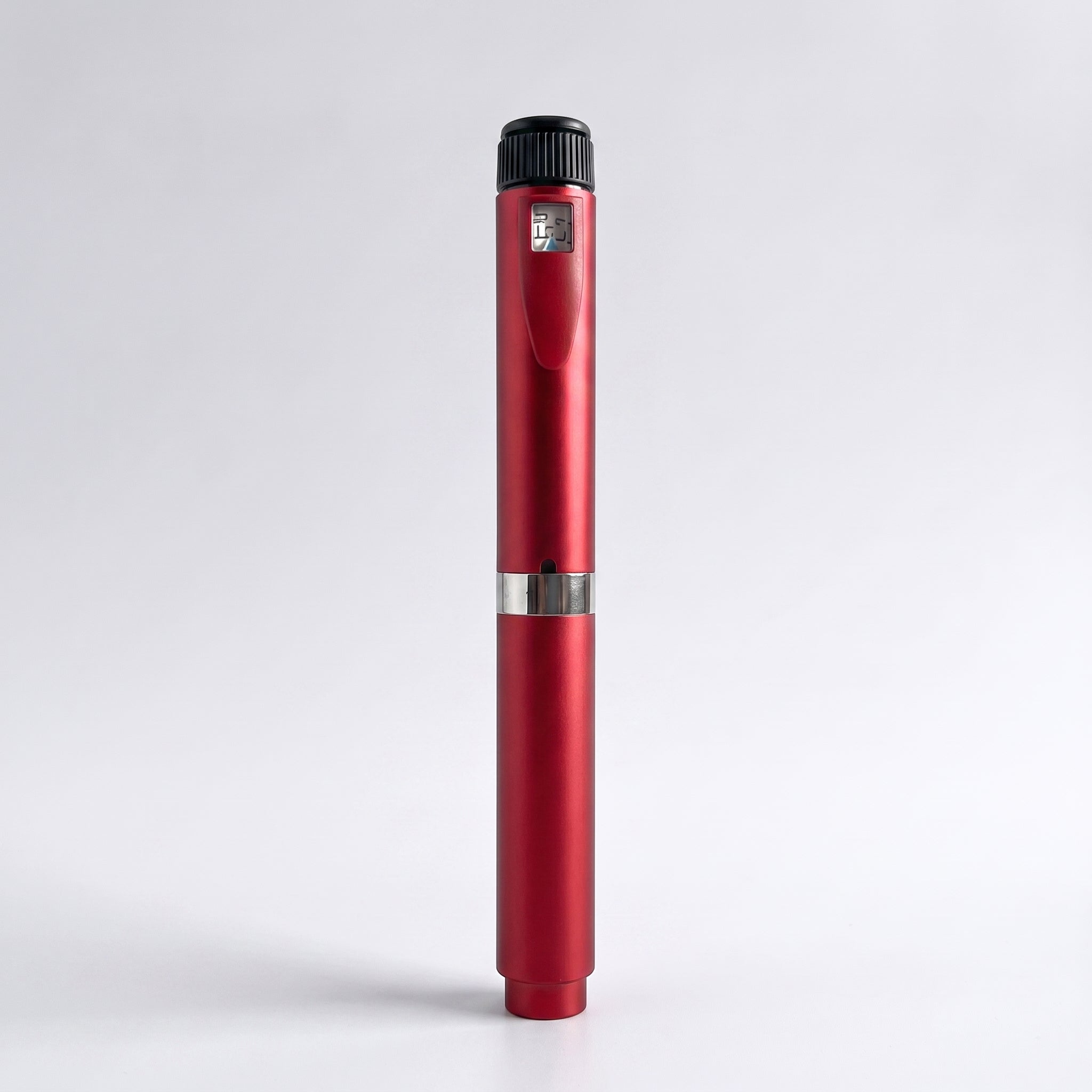 Red V2 Peptide Pen, reusable 60-unit pen with needle shield, standing upright on a pale studio background