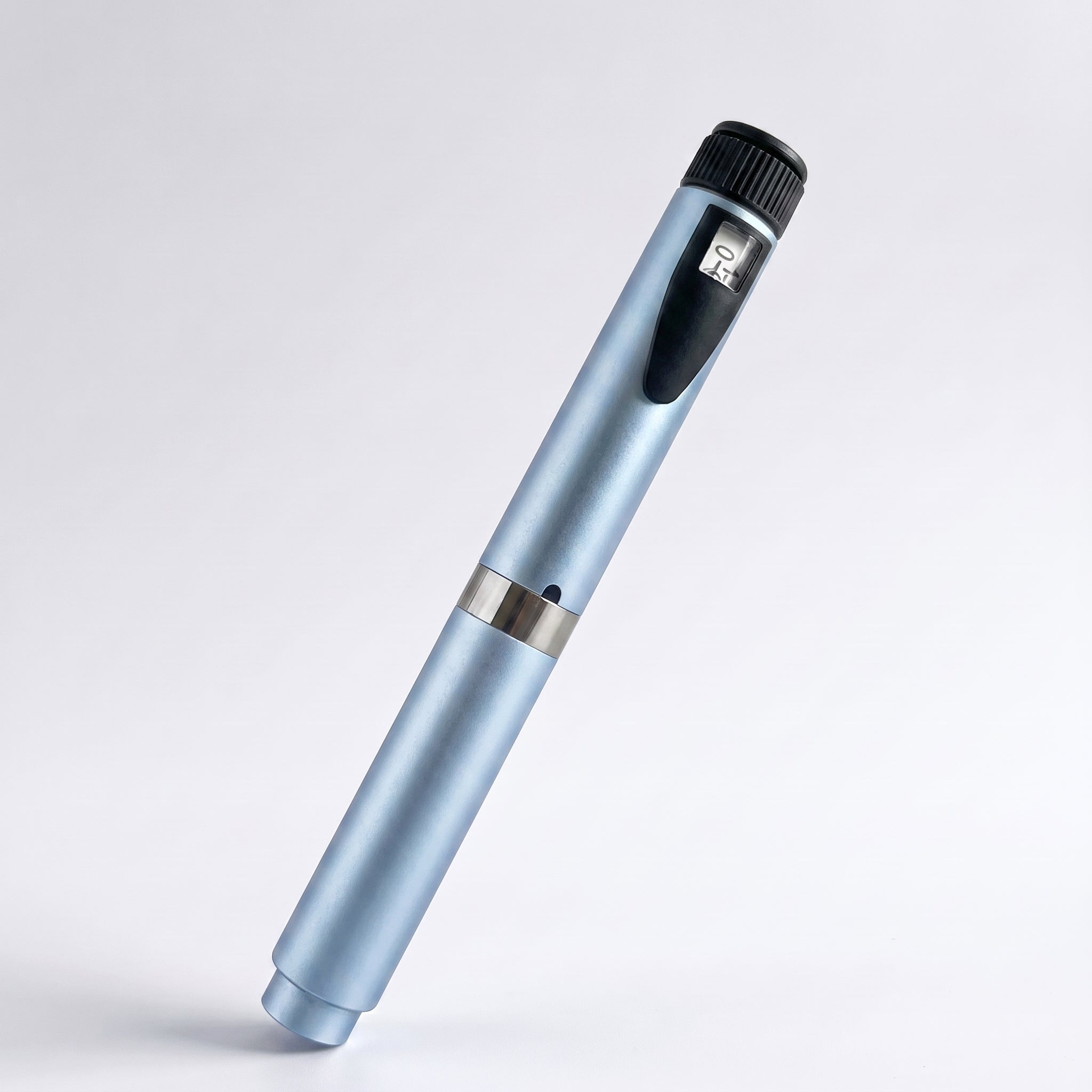 Ice blue V2 Peptide Pen, reusable 60-unit pen with needle shield, angled diagonally on a pale studio background