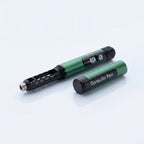Gansulin pen with its cap removed showing the cartridge holder, cap lying beside it