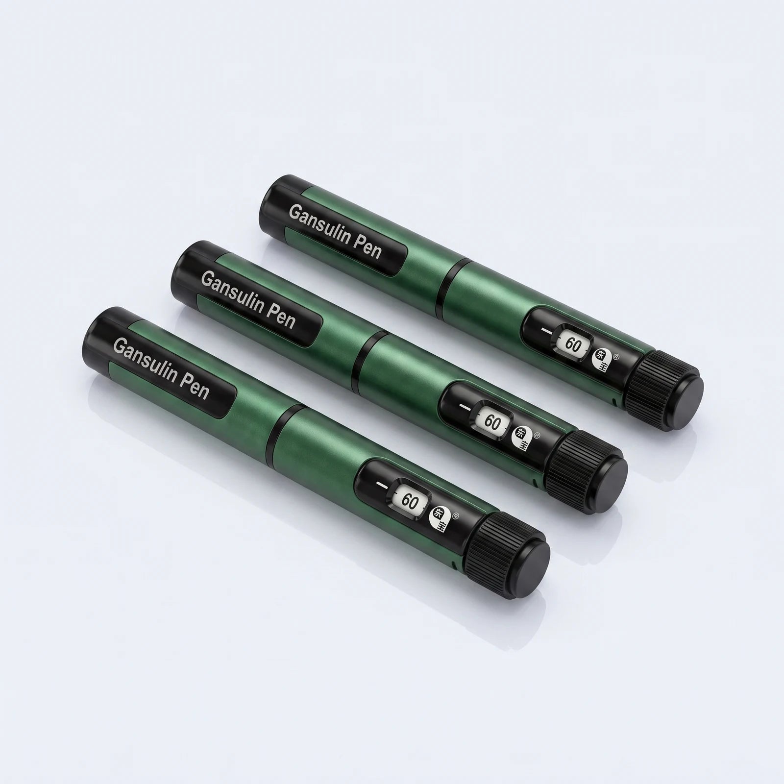 Three Gansulin pens fanned on a pale studio surface, each dose window showing 60