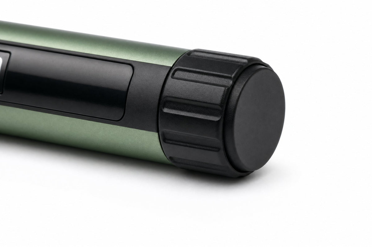 Close-up of the ribbed black dial knob at the end of the Gansulin pen